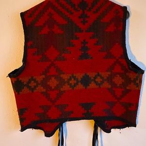 Wool rich wool vest missing 1 concho in photo but will put back on if sold.